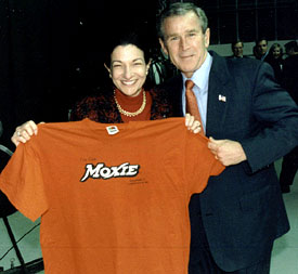 US Senator Olympia Snowe and former President George W. Bush pose with a MOXIE t-shirt.